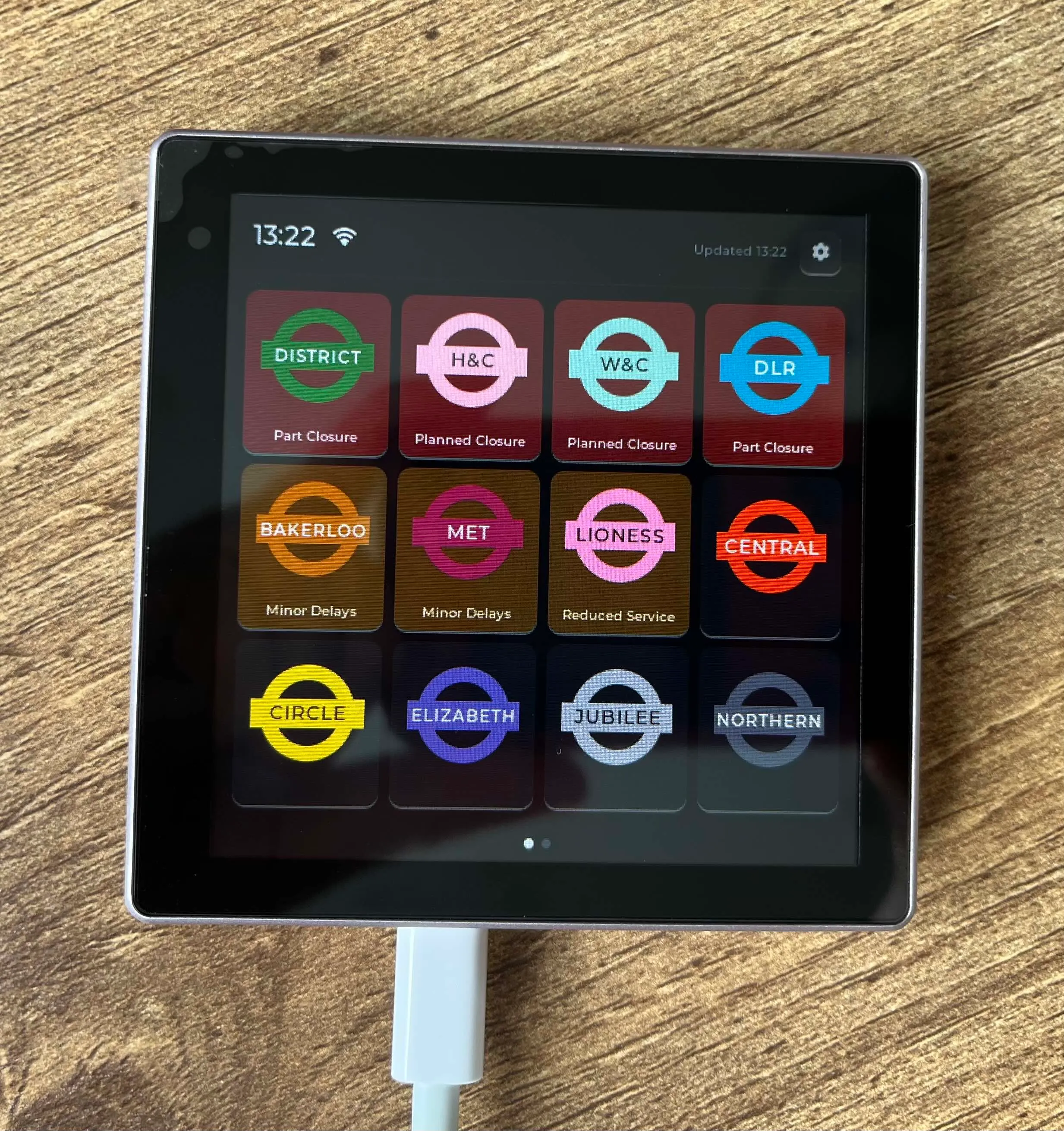 A touchscreen showing the status of multiple tube lines